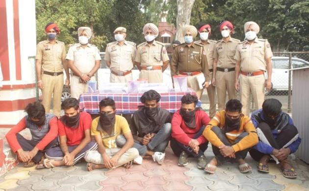 The seven gang members in police custody in Ludhiana on Wednesday. (HT Photo) The seven gang members in police custody in Ludhiana on Wednesday. (HT Photo)