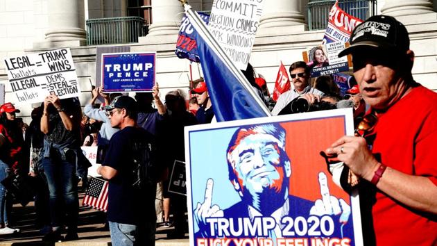 Supporters of US President Donald Trump attend a 'Stop the Steal' protest outside the Wisconsin state capitol, following the media’s announcement that US Democratic presidential candidate Joe Biden has won the 2020 election. (Reuters) Supporters of US President Donald Trump attend a 'Stop the Steal' protest outside the Wisconsin state capitol, following the media’s announcement that US Democratic presidential candidate Joe Biden has won the 2020 election. (Reuters)