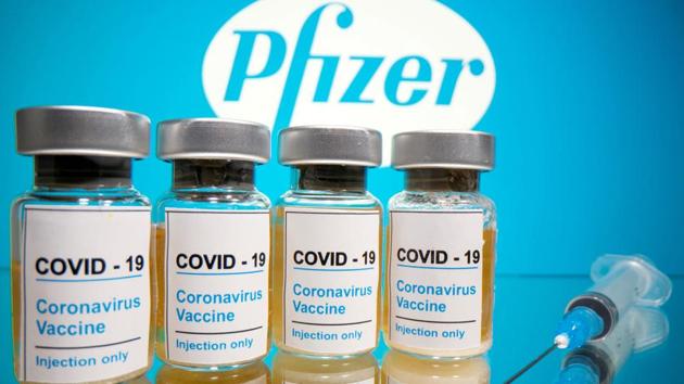 Vials with a sticker reading, "Covid-19 / Coronavirus vaccine / Injection only" and a medical syringe are seen in front of a displayed Pfizer logo.(Reuters File Photo) Vials with a sticker reading, "Covid-19 / Coronavirus vaccine / Injection only" and a medical syringe are seen in front of a displayed Pfizer logo.(Reuters File Photo)