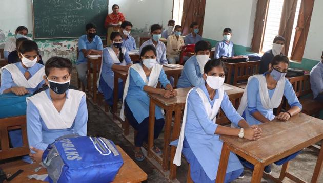 Students attending class at a government school in Kheri Asadh village. (HT PHOTO) Students attending class at a government school in Kheri Asadh village. (HT PHOTO)