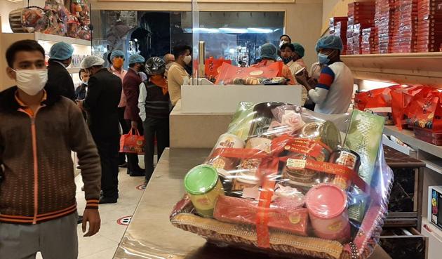 Sweets shops in Lucknow have place glass shields to maintain social distancing(HT Photo)