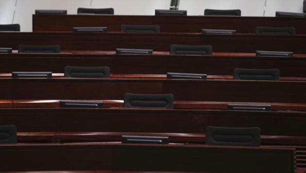 Empty seats in Hong Kong’s Legislative Chamber as opposition lawmakers resigned together in protest against China’s resolution, which gives local authorities power to unseat politicians. (AP Photo) Empty seats in Hong Kong’s Legislative Chamber as opposition lawmakers resigned together in protest against China’s resolution, which gives local authorities power to unseat politicians. (AP Photo)