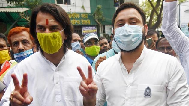 Bihar, Oct 14 (ANI): RJD candidate Tejaswi Yadav with brother Tej Pratap Yadav show victory sign after filing his nomination papers from Raghopur assembly seat ahead of Bihar assembly polls, in Vaishali on Wednesday. (ANI Photo)(ANI) Bihar, Oct 14 (ANI): RJD candidate Tejaswi Yadav with brother Tej Pratap Yadav show victory sign after filing his nomination papers from Raghopur assembly seat ahead of Bihar assembly polls, in Vaishali on Wednesday. (ANI Photo)(ANI)