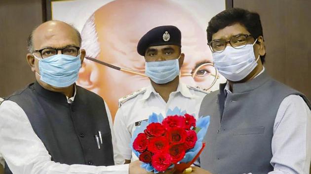 Jharkhand chief minister Hemant Soren presents a flower bouquet to Jharkhand assembly speaker Rabindra Nath Mahato during one day special session of Jharkhand assembly, in Ranchi.(PTI)