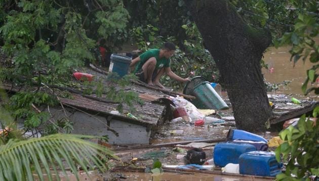 Flooding in 32 villages and a few landslides were already reported on Wednesday from the typhoon, and disaster officials said a man died and three other people were missing, without immediately providing details.(Reuters Photo) Flooding in 32 villages and a few landslides were already reported on Wednesday from the typhoon, and disaster officials said a man died and three other people were missing, without immediately providing details.(Reuters Photo)