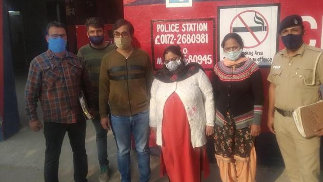 The accused couple (in blue denims and red suit) in the police custody on Thursday. (HT PHOTO) The accused couple (in blue denims and red suit) in the police custody on Thursday. (HT PHOTO)
