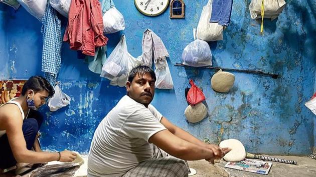 The playful Muhammed Sonu, rolling out the dough, picks up his giant wooden rolling pin and holds it like a film star clutching the rifle in the climactic scene of an action film. The customers standing outside clap like single-screen cinema audience.(SOURCED) The playful Muhammed Sonu, rolling out the dough, picks up his giant wooden rolling pin and holds it like a film star clutching the rifle in the climactic scene of an action film. The customers standing outside clap like single-screen cinema audience.(SOURCED)