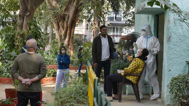 A health worker collects a swab sample to test for coronavirus infection at GK-1 in New Delhi. According to the Delhi government health bulletin, the city reported 8,593 cases on November 11. However, the day also saw the highest daily test count, as well as the most RT-PCR tests conducted on a single day Delhi. (Vipin Kumar / HT Photo) A health worker collects a swab sample to test for coronavirus infection at GK-1 in New Delhi. According to the Delhi government health bulletin, the city reported 8,593 cases on November 11. However, the day also saw the highest daily test count, as well as the most RT-PCR tests conducted on a single day Delhi. (Vipin Kumar / HT Photo)