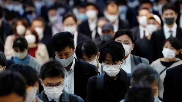 People wearing protective masks, following the coronavirus disease (Covid-19) outbreak, in Tokyo, Japan.(Reuters image) People wearing protective masks, following the coronavirus disease (Covid-19) outbreak, in Tokyo, Japan.(Reuters image)