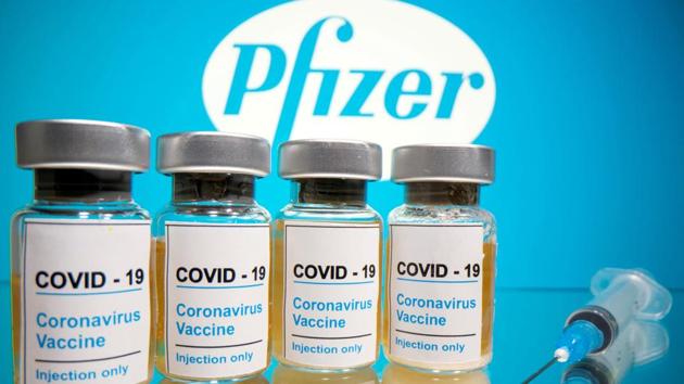 Vials with a sticker reading, "Covid-19 / Coronavirus vaccine / Injection only" and a medical syringe are seen in front of a displayed Pfizer logo.(Reuters File Photo) Vials with a sticker reading, "Covid-19 / Coronavirus vaccine / Injection only" and a medical syringe are seen in front of a displayed Pfizer logo.(Reuters File Photo)