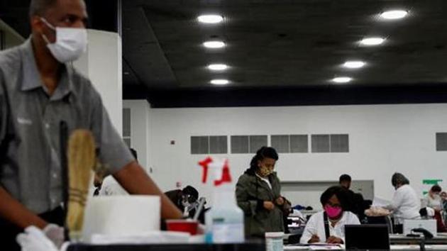 An automatic recount was called under the state law of Florida, which reduced the vote margin from 1,784 to 327.(REUTERS)