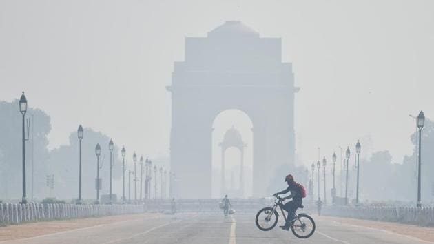 A cyclist rides a bicycle near India Gate covered with a thick layer of smog as the air quality deteriorates due to air pollution, in New Delhi on Thursday.(ANI file photo) A cyclist rides a bicycle near India Gate covered with a thick layer of smog as the air quality deteriorates due to air pollution, in New Delhi on Thursday.(ANI file photo)
