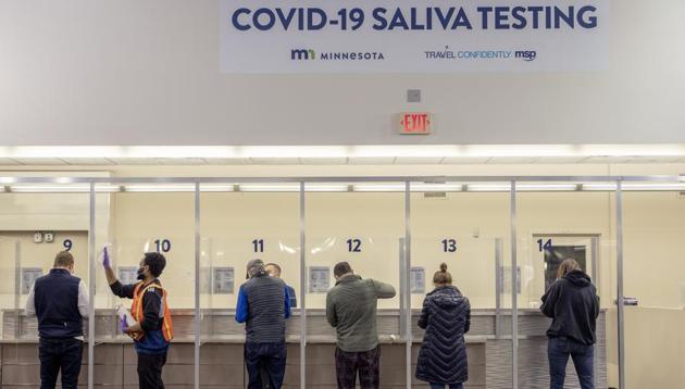 People get tested at the new saliva Covid-19 testing site at the Minneapolis-St. Paul International Airport. (AP File Photo) People get tested at the new saliva Covid-19 testing site at the Minneapolis-St. Paul International Airport. (AP File Photo)