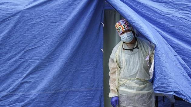 Medical works operate a testing tent at a Covid-19 mobile testing site in the Brooklyn borough of New York. (AP Photo) Medical works operate a testing tent at a Covid-19 mobile testing site in the Brooklyn borough of New York. (AP Photo)