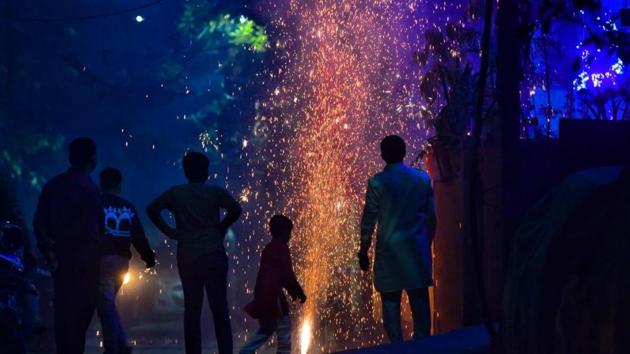 People bursting crackers in the National Capital Region on Diwali despite a ban on fireworks leading to rising pollution levels.(SANCHIT KHANNA/HT PHOTO.)