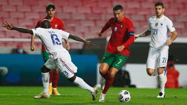 Portugal’s Cristiano Ronaldo in action with France’s N’Golo Kante.(Reuters)