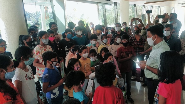Goa Chief Minister Pramod Sawant interacting with children who asked him to stop coal import and coal dust pollution in the state.(HT PHOTO) Goa Chief Minister Pramod Sawant interacting with children who asked him to stop coal import and coal dust pollution in the state.(HT PHOTO)