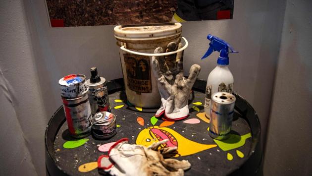 Empty tear gas cartridges, gloves and other objects used during the demonstrations are displayed at the Social Uprising Museum. The museum brings together the work of some 70 street artists, asked to reproduce their protest pieces and assemble assorted objects seen as emblematic of the protests. (Martin Barnetti / AFP)