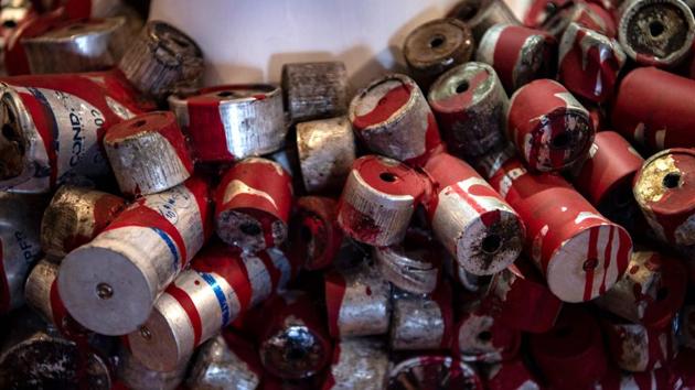 Empty tear gas cartridges are displayed at the Social Uprising Museum in Santiago on November 11. The museum opened at the beginning of November, just after the referendum in which Chileans voted overwhelmingly to replace the Pinochet-era constitution -- seen as the principal obstacle to fundamental reform. (Martin Barnetti / AFP)