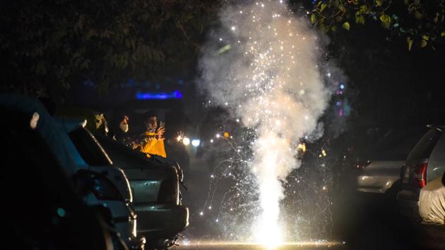 People bursting crackers at Patel Nagar in New Delhi on November 14. The use of firecrackers had been restricted in several states this year due to concerns over pollution and Covid-19. The link between air pollution and worsening Covid-19 cases remains mostly theoretical at the moment. But several researchers have said that dirty air should also be considered a key element in coronavirus outbreaks. (Sanchit Khanna / HT Photo) People bursting crackers at Patel Nagar in New Delhi on November 14. The use of firecrackers had been restricted in several states this year due to concerns over pollution and Covid-19. The link between air pollution and worsening Covid-19 cases remains mostly theoretical at the moment. But several researchers have said that dirty air should also be considered a key element in coronavirus outbreaks. (Sanchit Khanna / HT Photo)