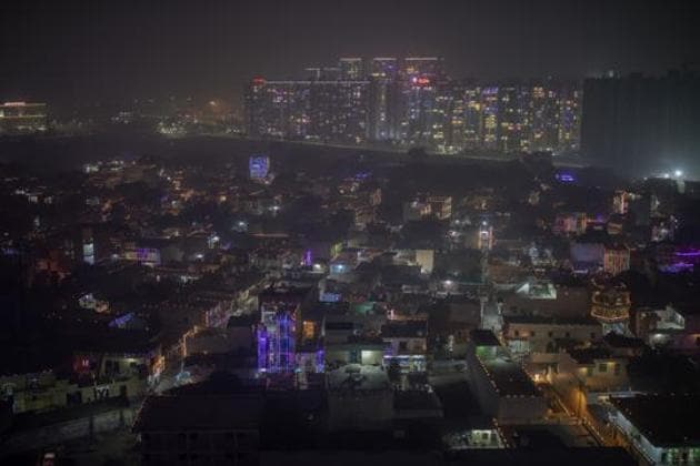 A layer of smog envelops the skyline as residential buildings are decorated with colorful lights during Diwali, November 14, 2020(AP) A layer of smog envelops the skyline as residential buildings are decorated with colorful lights during Diwali, November 14, 2020(AP)