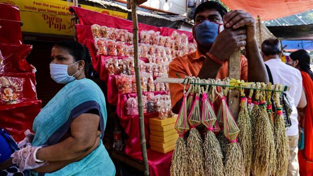A man sells sheaves of rice used to perform puja rituals in Kolkata on November 14. Speaking at the 8th BRICS (Brazil, Russia, India, China and South Africa) Science, Technology and Innovation Ministerial Meeting, Vardhan had said that India is also hosting clinical trials for all the major vaccines, and about 20 vaccines are in different stages of development. (Bikas Das / AP) A man sells sheaves of rice used to perform puja rituals in Kolkata on November 14. Speaking at the 8th BRICS (Brazil, Russia, India, China and South Africa) Science, Technology and Innovation Ministerial Meeting, Vardhan had said that India is also hosting clinical trials for all the major vaccines, and about 20 vaccines are in different stages of development. (Bikas Das / AP)