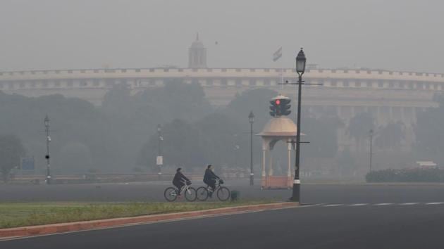 Parliament building in New Delhi engulfed in smog post Diwali celebrations. With no respite in the rising Covid-19 cases across the country, the centre has taken a cautious approach and is likely to decide against holding the Parliament’s winter session this year.(PTI)