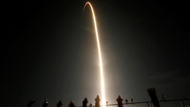 Spectators watch the launch of SpaceX Falcon 9 rocket, topped with the Crew Dragon capsule at Kennedy Space Center in Cape Canaveral, Florida on November 15. “That was one heck of a ride,” astronaut Mike Hopkins said from Crew Dragon to SpaceX mission control about an hour after lift-off. “There was a lot of smiles,” Reuters reported. (Joe Skipper / REUTERS)