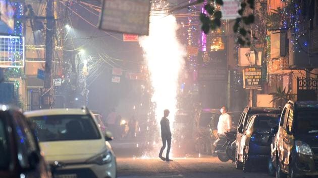 People burning firecrackers on Diwali in Pandav Nagar in New Delhi.(Raj K Raj/HT PHOTO)