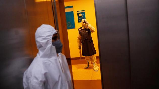 A medical worker holds a X-ray of a patient suffering from the coronavirus disease (Covid-19), waits outside a lift at a hospital.(REUTERS) A medical worker holds a X-ray of a patient suffering from the coronavirus disease (Covid-19), waits outside a lift at a hospital.(REUTERS)
