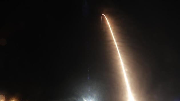 A Falcon 9 SpaceX rocket with the Crew Dragon capsule is seen during a time exposure as it lifts off from pad 39A at the Kennedy Space Center in Cape Canaveral.(AP)