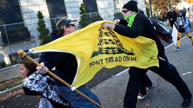 Counter protesters clash with a Trump supporter (C) at Black Lives Matter Plaza in Washington, D.C., on November 14. Multiple confrontations appeared later in the day as small groups of Trump supporters attempted to enter the area around Black Lives Matter Plaza, near the White House, where several hundred anti-Trump demonstrators had gathered. (Olivier Douliery / AFP) Counter protesters clash with a Trump supporter (C) at Black Lives Matter Plaza in Washington, D.C., on November 14. Multiple confrontations appeared later in the day as small groups of Trump supporters attempted to enter the area around Black Lives Matter Plaza, near the White House, where several hundred anti-Trump demonstrators had gathered. (Olivier Douliery / AFP)