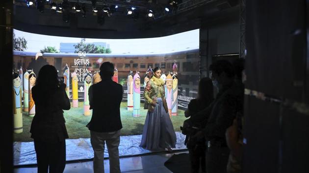 A model poses for a film pre-shot to be showcased online during Lotus make-up India Fashion week in New Delhi. (AP) A model poses for a film pre-shot to be showcased online during Lotus make-up India Fashion week in New Delhi. (AP)