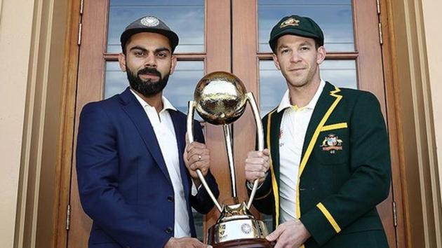 Indian captain Virat Kohli (L) and Australian captain Tim Paine (R) with the Border-Gavaskar Trophy(Twitter)
