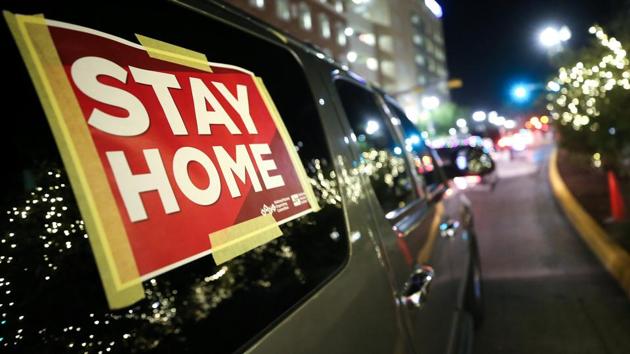 'Stay Home' sign is taped to a vehicle participating in a car caravan of nurses calling for people to stay inside amid a surge of Covid-19 cases in El Paso on November 16, 2020 in El Paso, Texas. (AFP photo) 'Stay Home' sign is taped to a vehicle participating in a car caravan of nurses calling for people to stay inside amid a surge of Covid-19 cases in El Paso on November 16, 2020 in El Paso, Texas. (AFP photo)