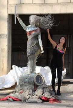 Lebanese artist, Hayat Nazer, poses near her statue made entirely out of broken glass and debris of the August 4 port explosion, during an interview with Reuters in Beirut, Lebanon November 10, 2020. Picture taken November 10, 2020. REUTERS/Mohamed Azakir (REUTERS)