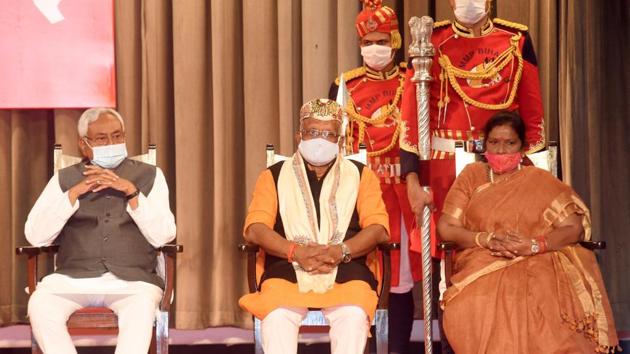 Chief minister Nitish Kumar with deputy chief ministers Tarkishore Prasad and Renu Devi after they were administered oath of office at Raj Bhawan, in Patna, Bihar on November 16, 2020.(Santosh Kumar/HT Photo)