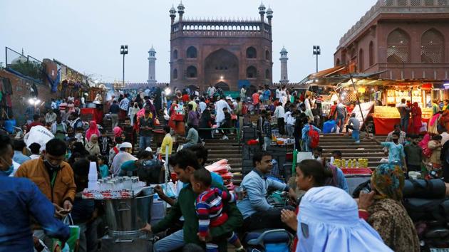 People shop at a market, amid the Covid-19 outbreak, in front of the Jama Masjid in the old quarters of Delhi on November 16, 2020.(Reuters Photo)