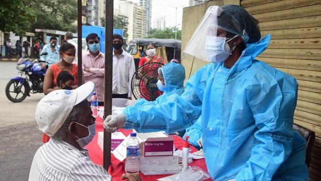 NMMC Health Workers take swap sample for Rapid Antigen Test during Covid-19 mass testing at Ghansoli Village in Navi Mumbai, India, on Thursday, August 13, 2020 (Photo by Bachchan Kumar/ HT PHOTO) (HT PHOTO) NMMC Health Workers take swap sample for Rapid Antigen Test during Covid-19 mass testing at Ghansoli Village in Navi Mumbai, India, on Thursday, August 13, 2020 (Photo by Bachchan Kumar/ HT PHOTO) (HT PHOTO)