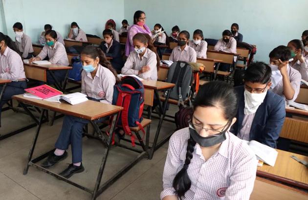 Students attending a class at Government Senior Secondary School for Girls at Bohar village in Rohtak district last week.(Manoj Dhaka/HT)