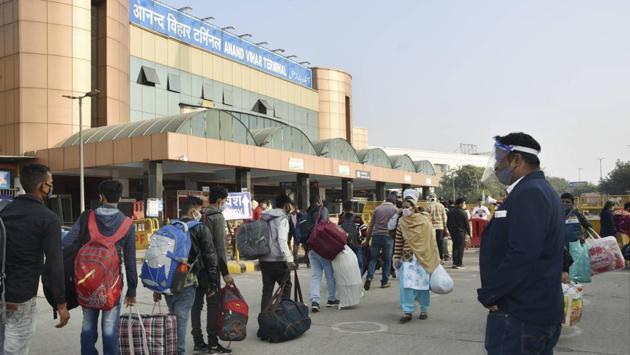 People queue outside Anand Vihar Railway Station as they leave for homes in other states for Chhath festival, in New Delhi on November 18. Despite the national tally of the daily Covid-19 cases falling, the virus seems to be resurfacing in several states including Delhi which is under the third wave of infections and recorded 6,396 new cases on November 17 according to the state health bulletin. (PTI) People queue outside Anand Vihar Railway Station as they leave for homes in other states for Chhath festival, in New Delhi on November 18. Despite the national tally of the daily Covid-19 cases falling, the virus seems to be resurfacing in several states including Delhi which is under the third wave of infections and recorded 6,396 new cases on November 17 according to the state health bulletin. (PTI)