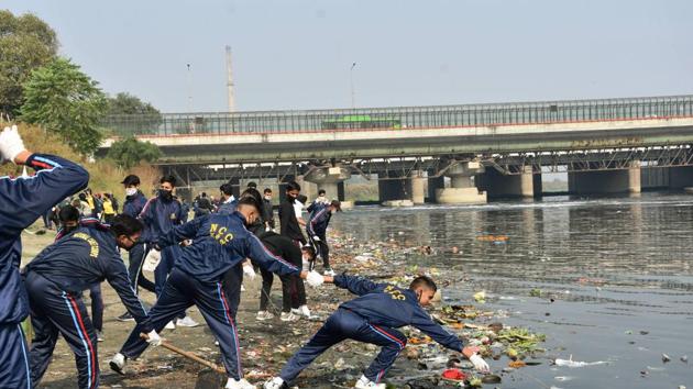 NCC cadets clean the banks of Yamuna river during 'Chhath' festival in New Delhi, Wednesday. (PTI) NCC cadets clean the banks of Yamuna river during 'Chhath' festival in New Delhi, Wednesday. (PTI)