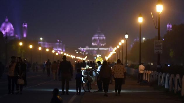People out in the evening on Rajpath with Rashtrapati Bhawan visible in the distance on November 16. The AQI is headed for another improvement and into the “moderate” category by November 19, V K Soni told PTI. (Sanjeev Verma / HT Photo) People out in the evening on Rajpath with Rashtrapati Bhawan visible in the distance on November 16. The AQI is headed for another improvement and into the “moderate” category by November 19, V K Soni told PTI. (Sanjeev Verma / HT Photo)
