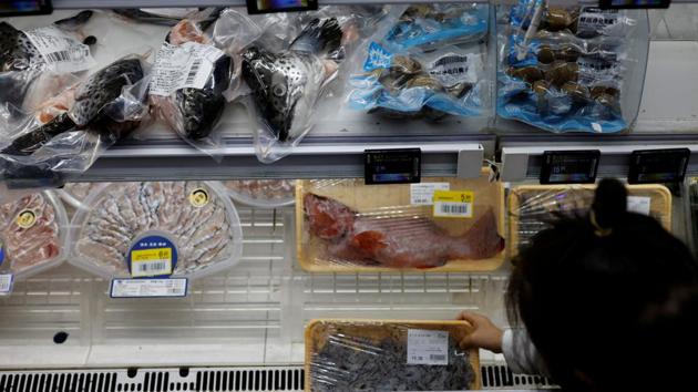 A customer shops for seafood at a supermarket in Shanghai, China.(REUTERS/ FILE) A customer shops for seafood at a supermarket in Shanghai, China.(REUTERS/ FILE)