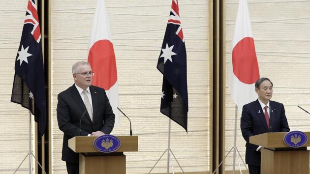 Scott Morrison, Australia's prime minister, left, speaks while Yoshihide Suga, Japan's prime minister.(Bloomberg)