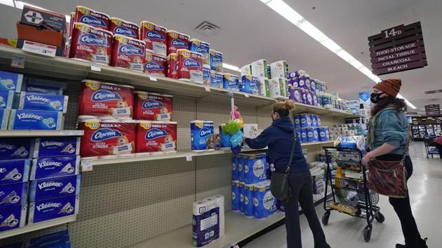 A woman buys toilet paper at a market in Mount Lebanon, Pa, on Tuesday.(AP Photo) A woman buys toilet paper at a market in Mount Lebanon, Pa, on Tuesday.(AP Photo)