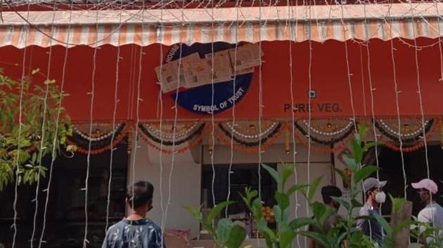 A sweet shop owner in Mumbai covered the word ‘Karachi’ on his establishment’s hoarding with a paper on Thursday. (ANI Photo) A sweet shop owner in Mumbai covered the word ‘Karachi’ on his establishment’s hoarding with a paper on Thursday. (ANI Photo)