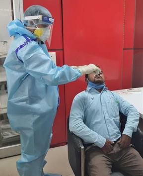 Health department workers taking a sample for Covid testing in Ludhiana.(HT FILE)