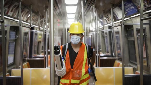 A contractor uses an electrostatic sprayer to disinfect subway cars to control the spread of Covid-19, in New York.(AP File Photo) A contractor uses an electrostatic sprayer to disinfect subway cars to control the spread of Covid-19, in New York.(AP File Photo)