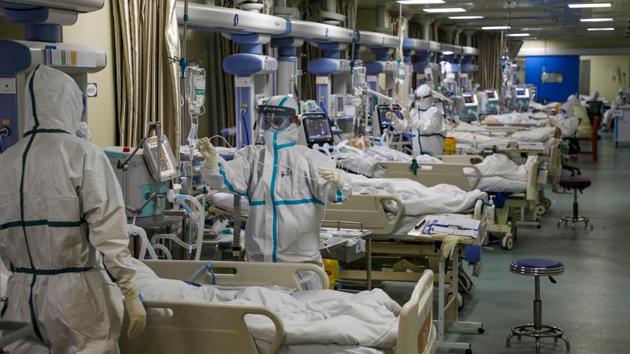 Medical workers in protective suits attend to Covid-19 patients at the ICU of a designated hospital in Wuhan, Hubei province, China.(REUTERS/ FILE) Medical workers in protective suits attend to Covid-19 patients at the ICU of a designated hospital in Wuhan, Hubei province, China.(REUTERS/ FILE)